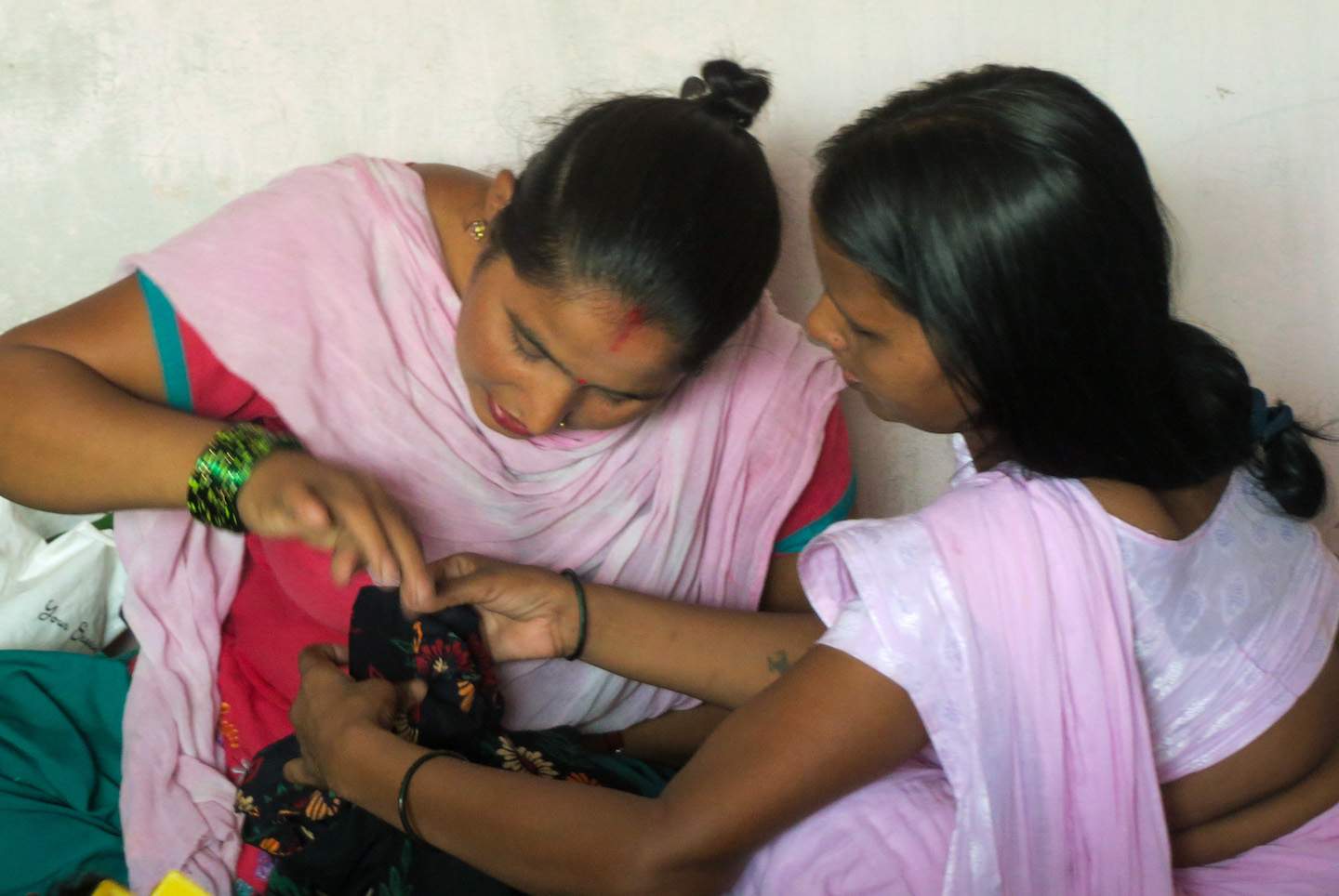 Through IGO evangelists, two women develop skills with a sewing machine, enabling them to escape from the discrimination single women face in India.