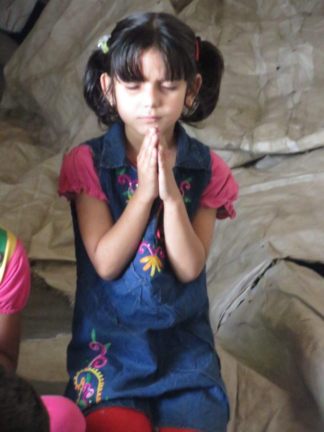 Girl Praying at Asha Kiran Dairy Complex