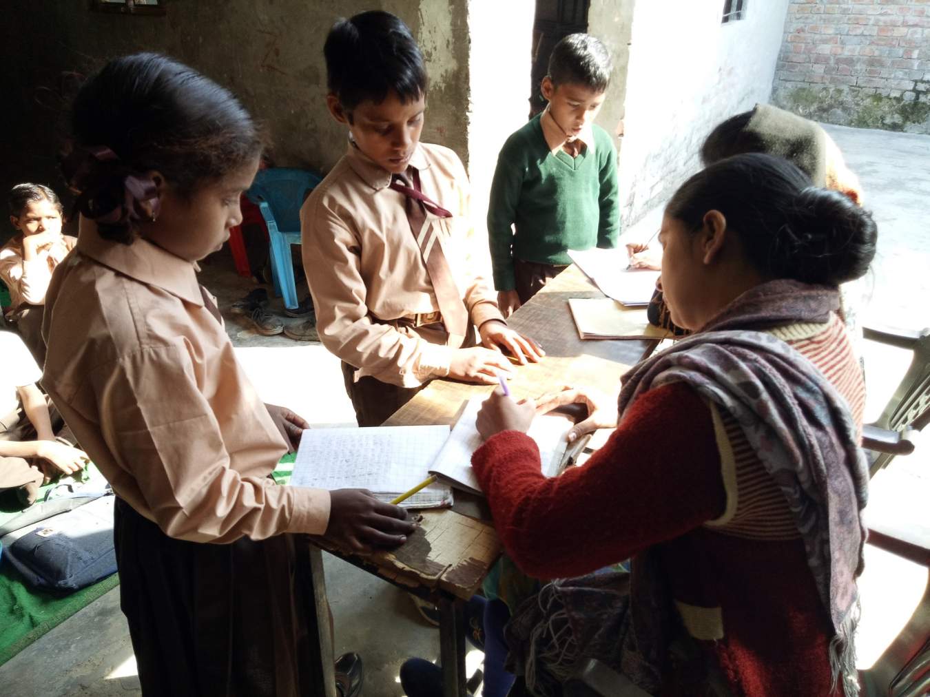 An Asha Kiran teacher gives individualized help to her students.