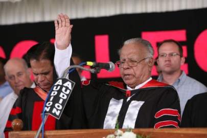 Pastor Abraham prays for graduates at the 2009 IBC graduation. Next to him is his son, IGO President Valson Abraham. Behind Stephen stands Coby Cummings, whose grandparents hosted him during studies in the US in the early 1950s.