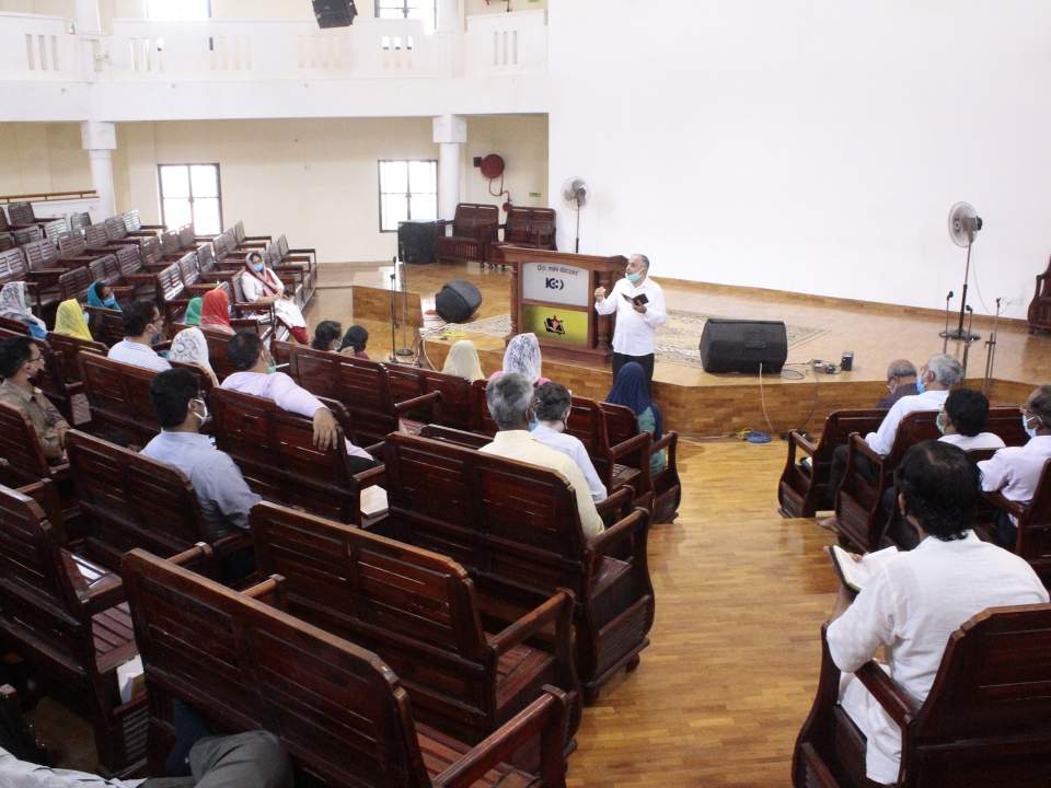 Faculty members at India Bible College and Seminary gather for prayer.