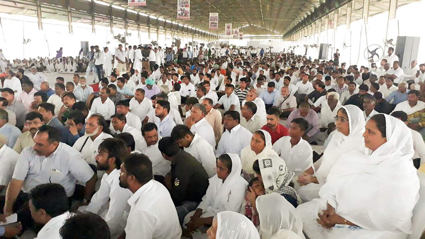 Part of the crowd of 7,000+ who attended the funeral for Pastor Sultan. His wife, Mrs. Sarbjit Kaur, sits at the far right, dressed in white.